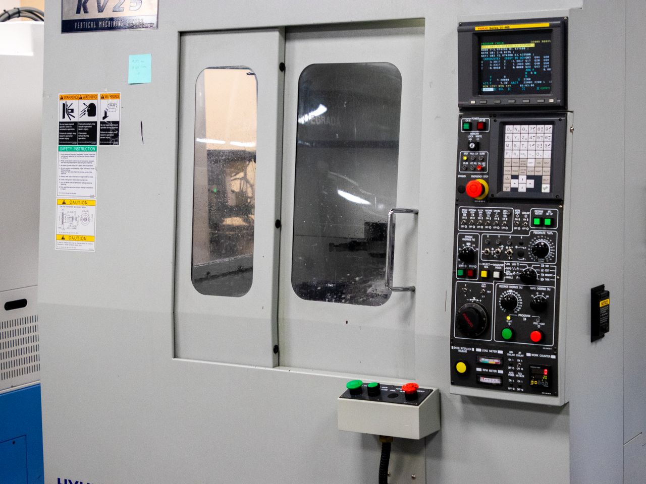 Services A modern CNC machine control panel used for precise industrial processes indoors.